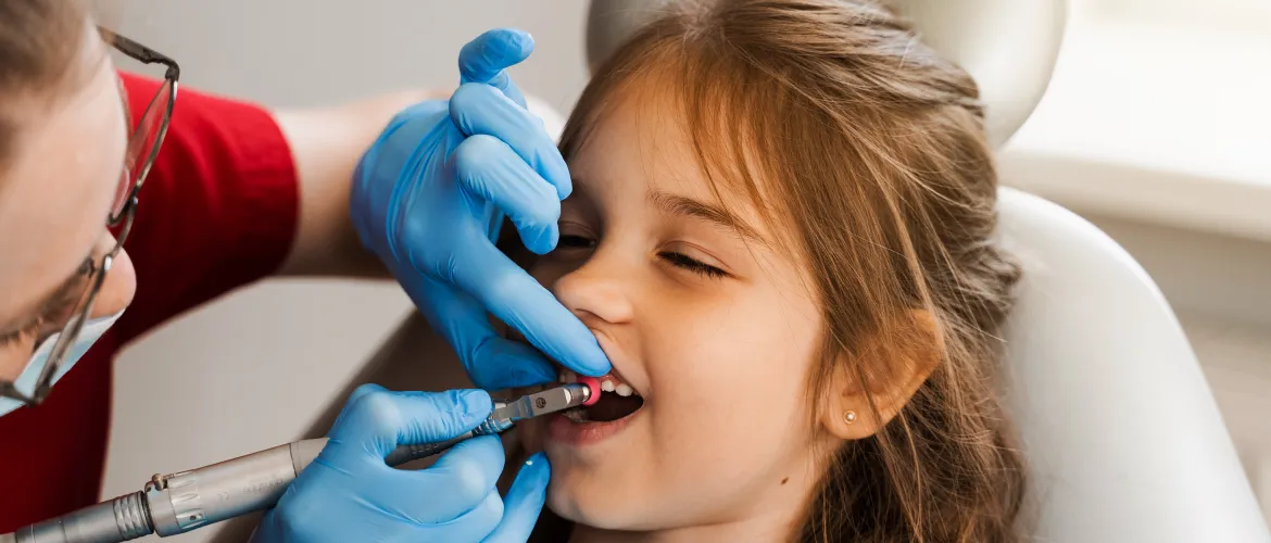child-dentist-makes-professional-teeth-cleaning-dentistry-professional-hygiene-teeth-child-dentistry-pediatric-dentist-examines-consults-kid-patient-dentistry (1) 1