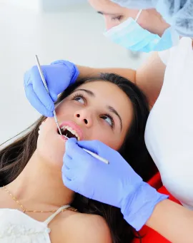 dentist-examines-teeth 1