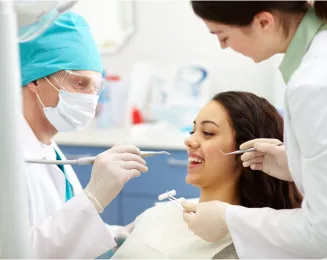 dentist-examining-patient-s-teeth 1